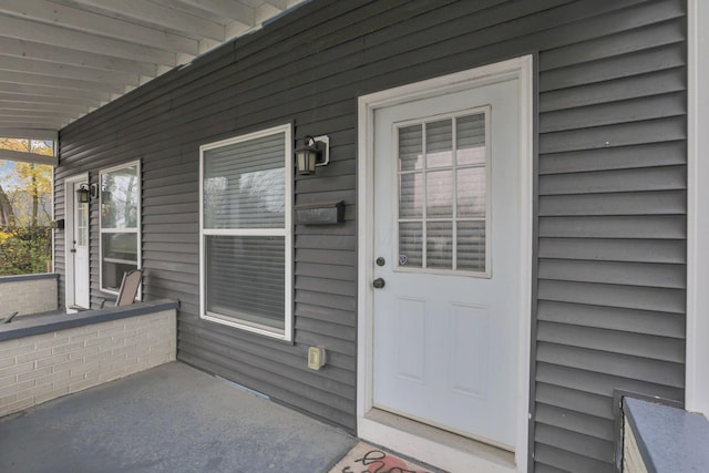 entrance to property with a porch