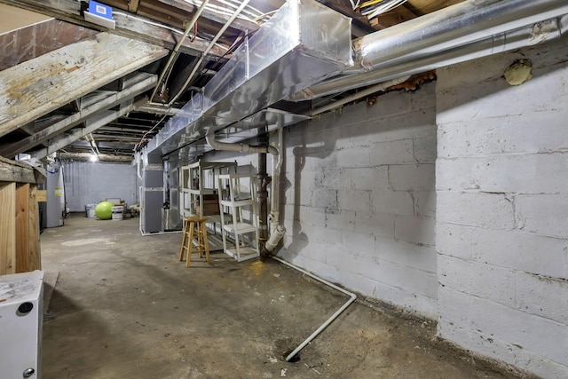 basement featuring heating unit and gas water heater