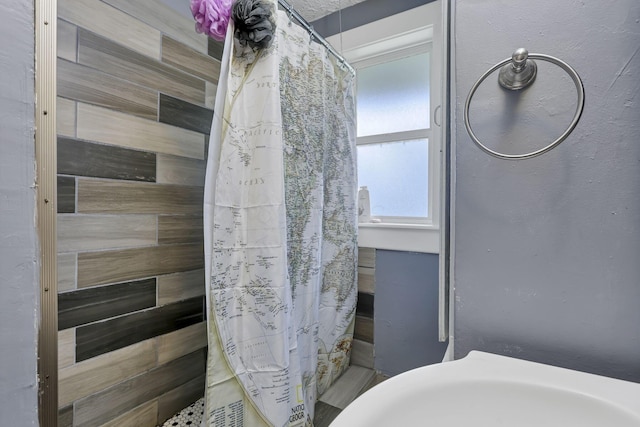 bathroom with curtained shower