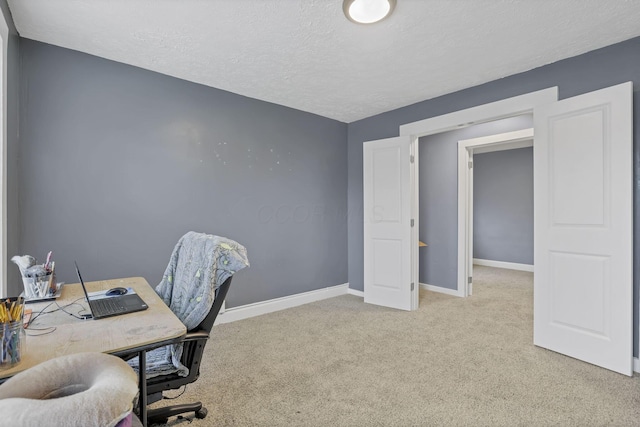 carpeted office with a textured ceiling