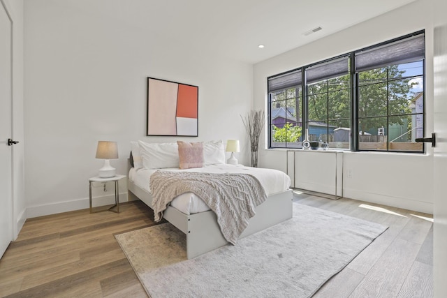 bedroom featuring hardwood / wood-style flooring