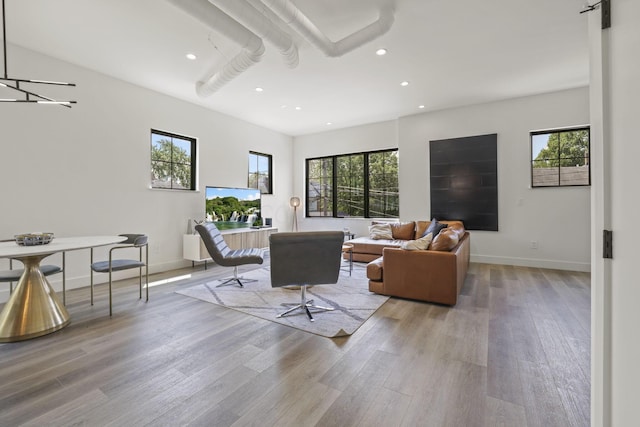 living room with light wood-type flooring and a wealth of natural light