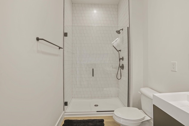 bathroom with vanity, toilet, and walk in shower