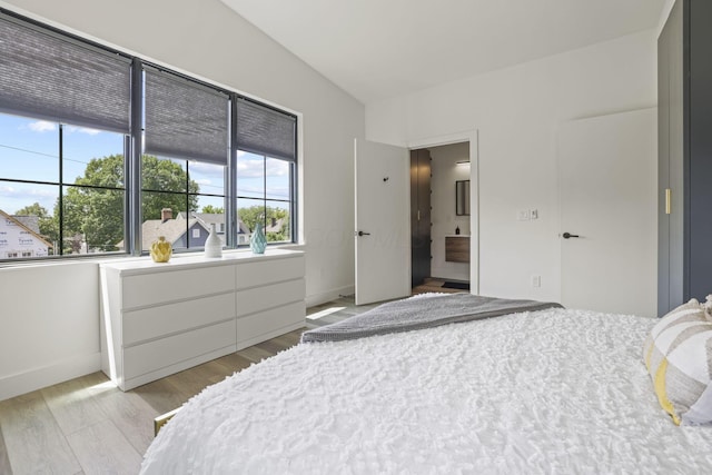 bedroom with light hardwood / wood-style floors