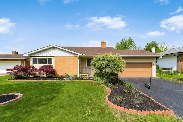 1677 Kenview Rd, Columbus, OH 43209 - single story home featuring a garage, a front lawn, and aphalt driveway