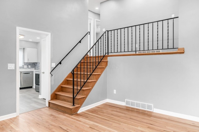1677 Kenview Rd, Columbus, OH 43209 - stairs with recessed lighting, baseboards, visible vents, and wood finished floors