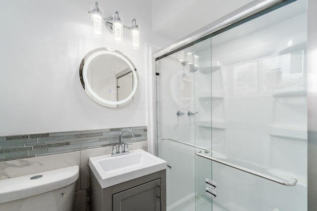 1677 Kenview Rd, Columbus, OH 43209 - bathroom with toilet, tile walls, a shower stall, and vanity