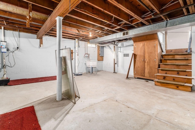 1677 Kenview Rd, Columbus, OH 43209 - unfinished basement with visible vents, a sink, stairs, and concrete block wall