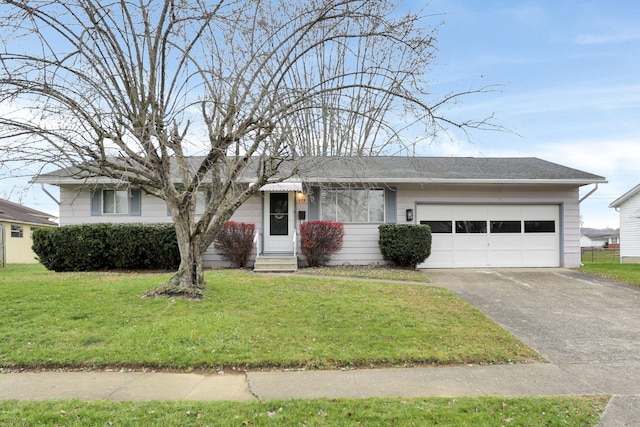 ranch-style house featuring a garage and a front lawn