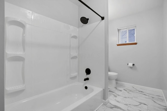 bathroom with washtub / shower combination and toilet