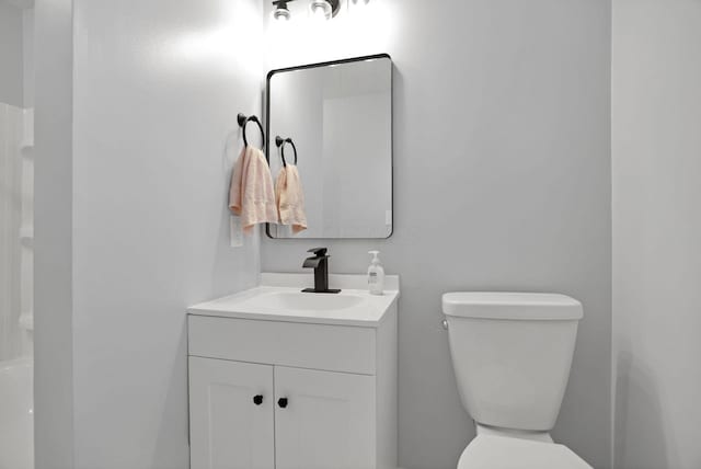 bathroom featuring vanity and toilet