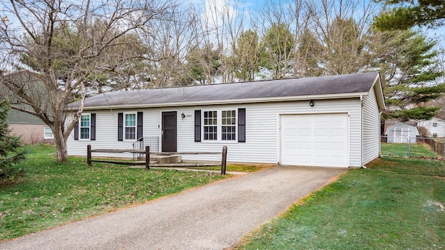 ranch-style house featuring a garage and a front lawn