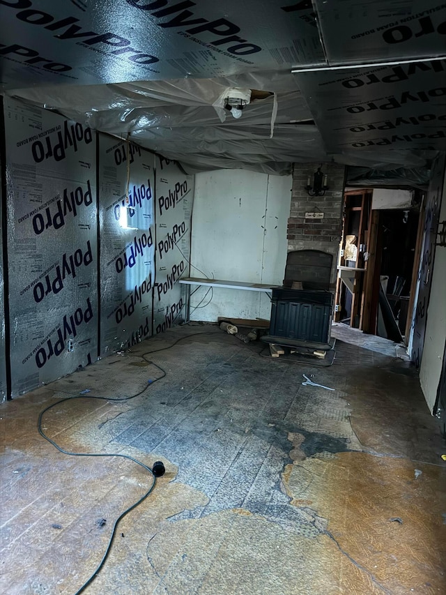 basement featuring a wood stove