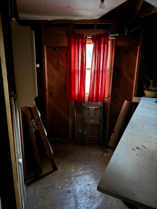 miscellaneous room with wooden walls