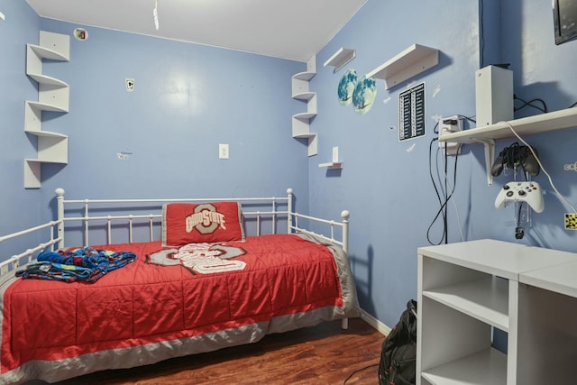 bedroom featuring dark hardwood / wood-style flooring