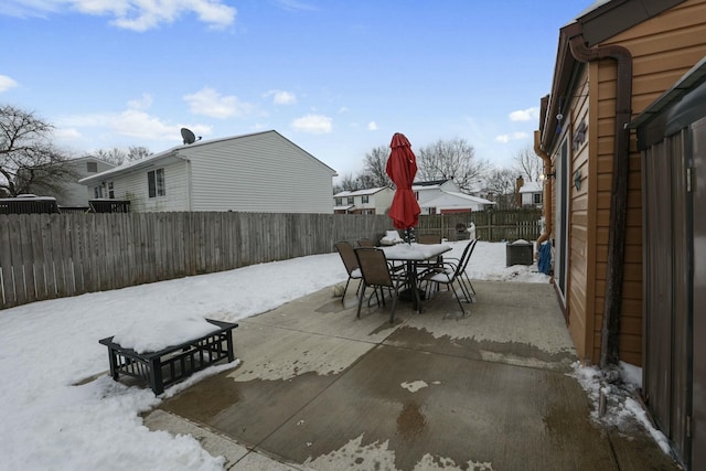 view of snow covered patio