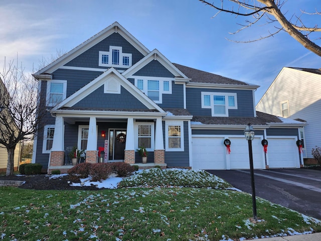 7201 Dean Farm Rd, New Albany, OH 43054 - view of front of property with driveway, a porch, a front yard, brick siding, and an attached garage