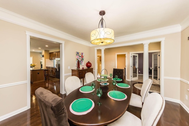 7201 Dean Farm Rd, New Albany, OH 43054 - dining room with ornate columns, dark wood finished floors, crown molding, and baseboards