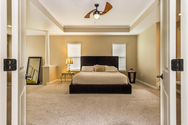 7201 Dean Farm Rd, New Albany, OH 43054 - bedroom with crown molding, a tray ceiling, carpet, baseboards, and ornate columns