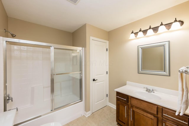 7201 Dean Farm Rd, New Albany, OH 43054 - bathroom featuring vanity, bath / shower combo with glass door, tile patterned floors, and baseboards