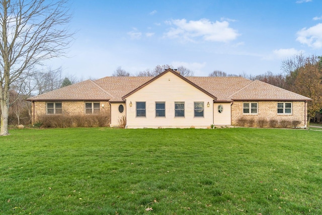 ranch-style home featuring a front yard