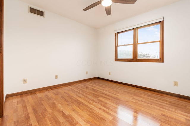 empty room featuring ceiling fan and light wood-type flooring