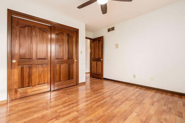 unfurnished bedroom featuring a closet, ceiling fan, and light hardwood / wood-style flooring