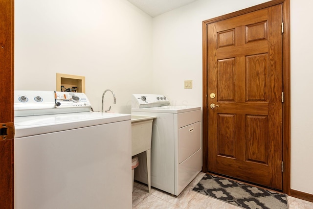 laundry room with independent washer and dryer