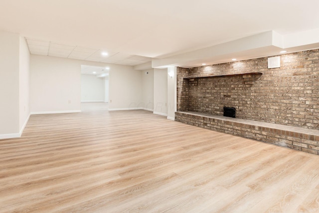 basement featuring light hardwood / wood-style floors