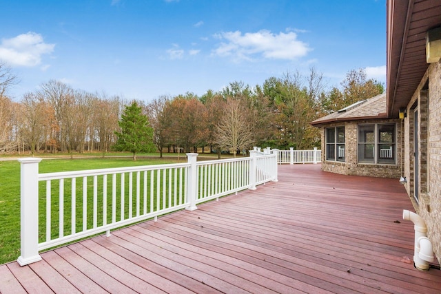 wooden terrace with a yard