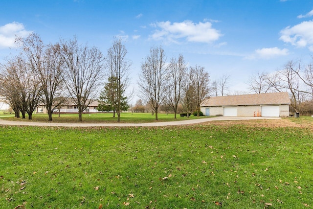 view of yard with a garage