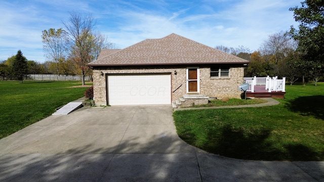 single story home featuring a garage, a wooden deck, and a front lawn