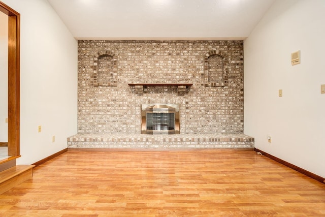 unfurnished living room with light hardwood / wood-style floors