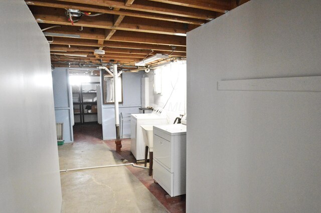 clothes washing area featuring washer and dryer