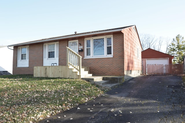 view of front of property featuring an outbuilding and a garage