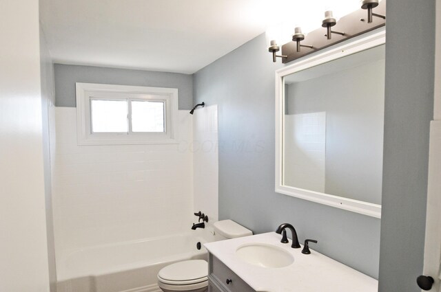 full bathroom with shower / tub combination, vanity, and toilet