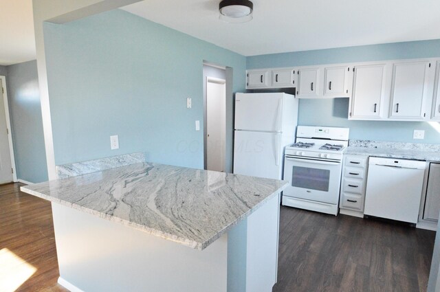 kitchen featuring kitchen peninsula, white appliances, dark hardwood / wood-style floors, and white cabinetry