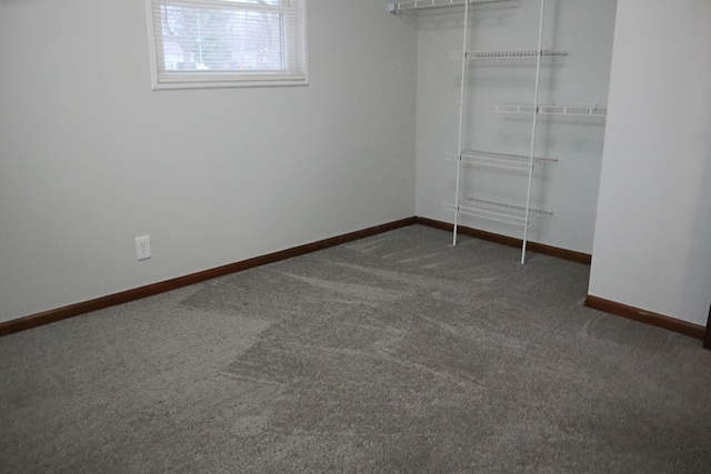 interior space featuring dark carpet