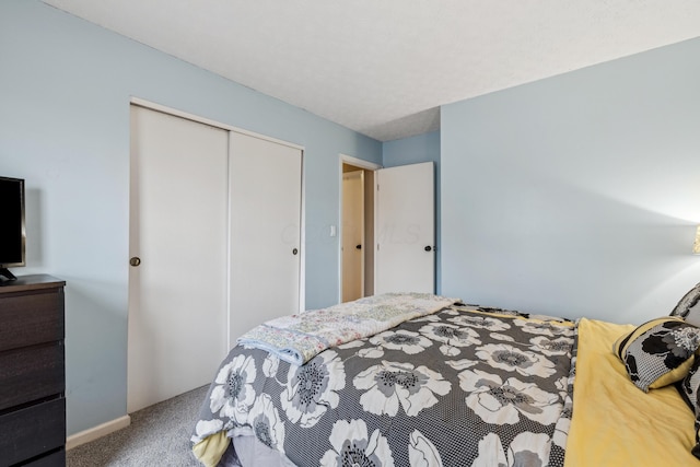 carpeted bedroom with a closet