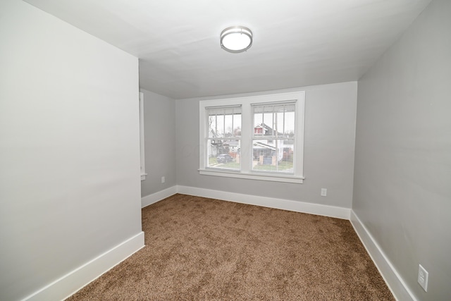 spare room featuring carpet floors