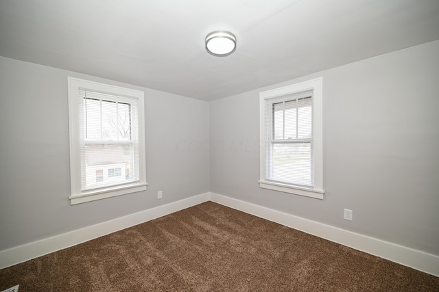 unfurnished room with carpet flooring