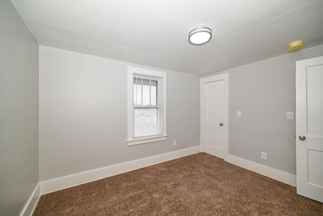 unfurnished room with carpet flooring