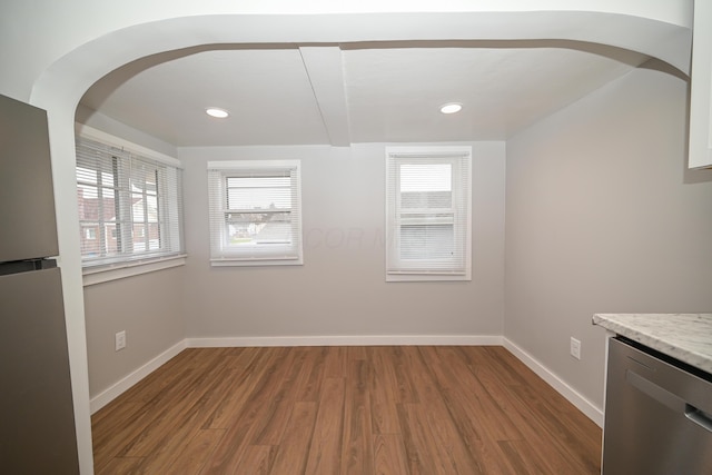 unfurnished dining area featuring hardwood / wood-style flooring