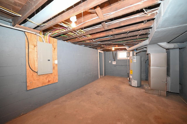 basement featuring heating unit, electric panel, and water heater