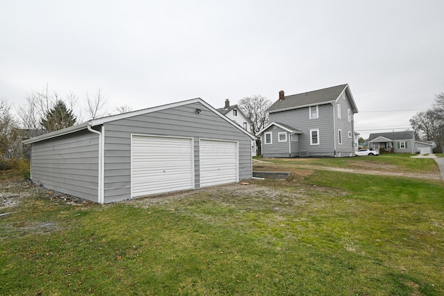 garage with a lawn