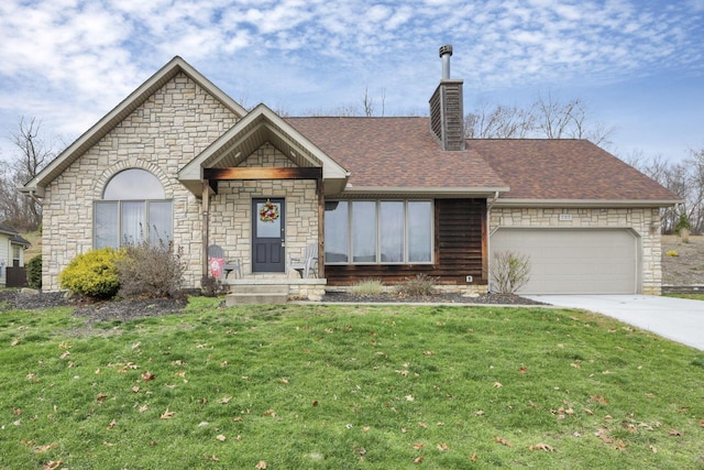 view of front of home with a front yard and a garage