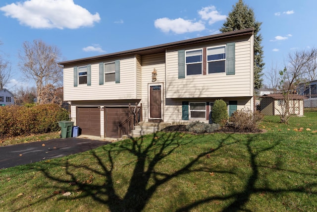 bi-level home featuring a front yard and a garage