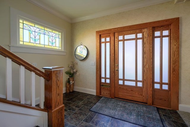 foyer featuring crown molding