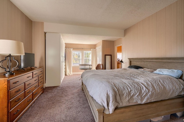 carpeted bedroom with a textured ceiling