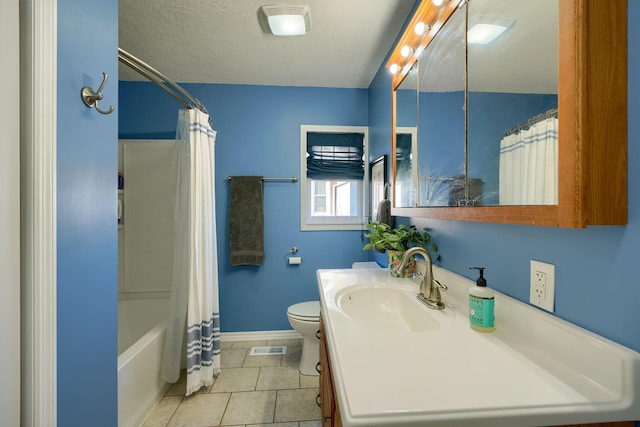 full bathroom with shower / bath combo, vanity, tile patterned flooring, toilet, and a textured ceiling